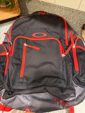 Oakley Black and Red Backpack with Multiple Pockets